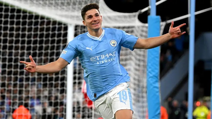 Photo of Julen Alvarez running on the field wearing a Manchester City shirt