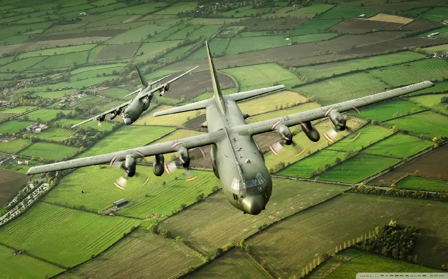 Photo of several Hercules C 130 military aircraft in flight