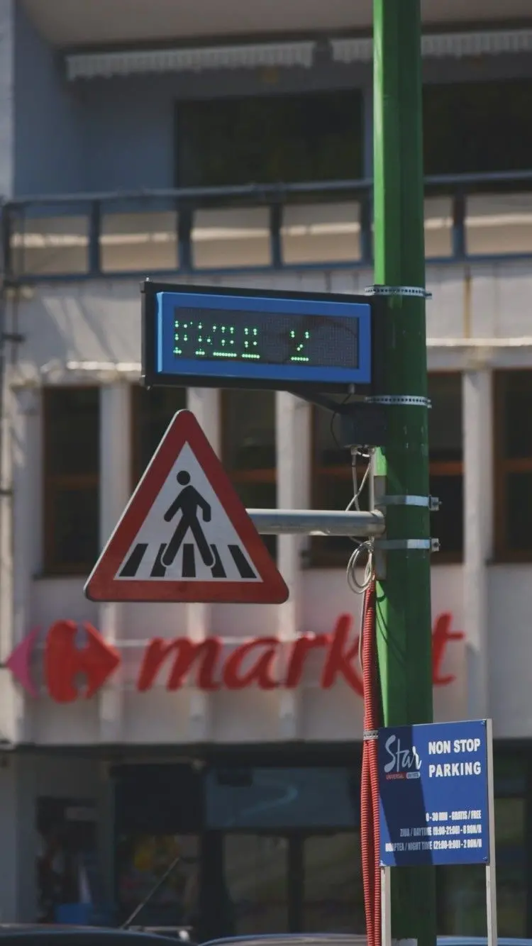 Vertical image of traffic signs warning of pedestrian crossing