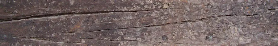 Brown coloured timber with large cracks