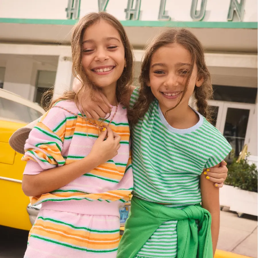 Stock photo of two beautiful girls in stylish clothes together