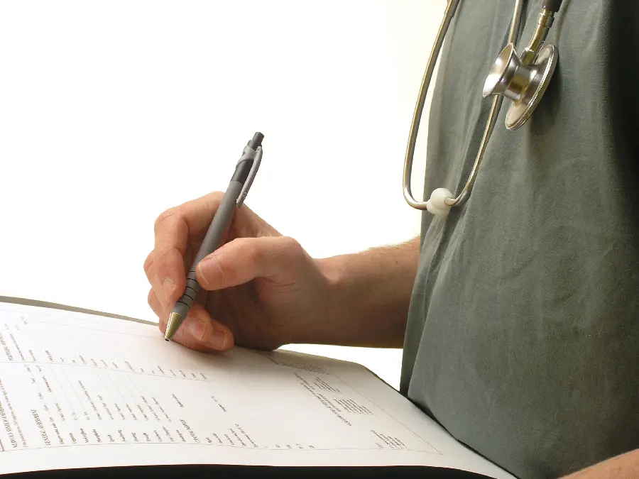 Photo of a doctor writing a prescription