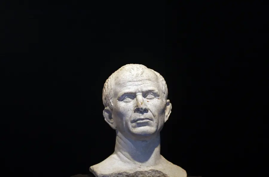 Download image of the head of the statue of Julius Caesar on a black background