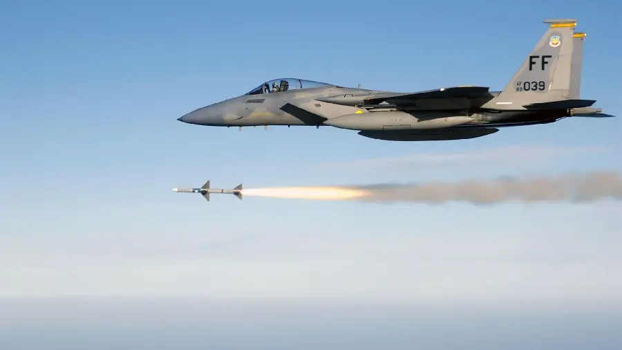 Military aircraft firing a missile with a tracking warhead
