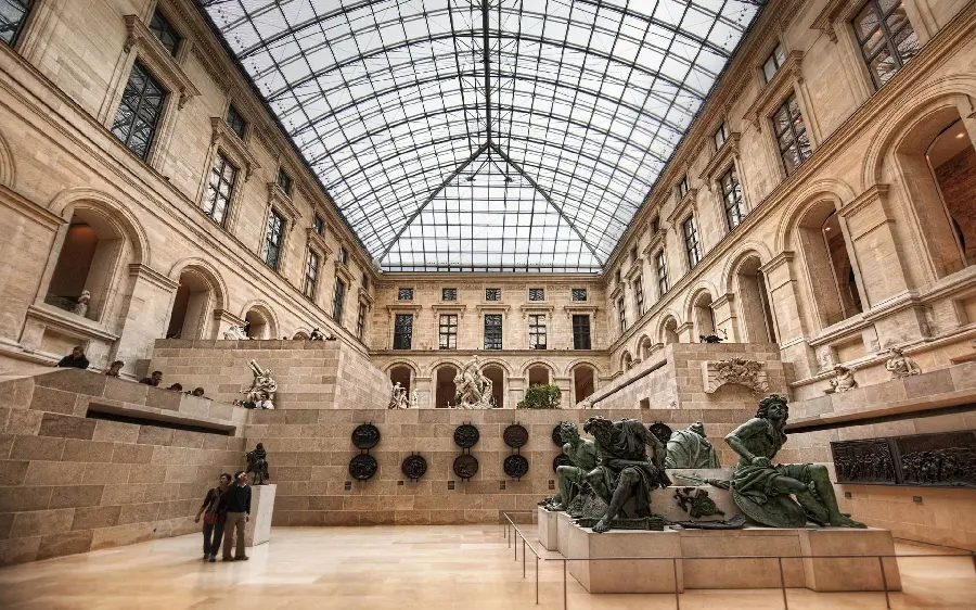 Statues and ancient artifacts inside the museum Louvre Paris France