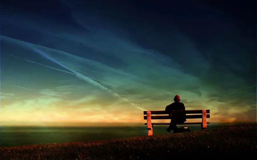 Download high quality wallpaper of a lonely boy sitting alone on a bench