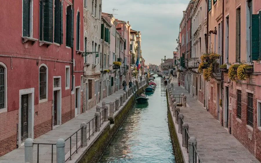 Photo of sidewalks along waterways in Italy