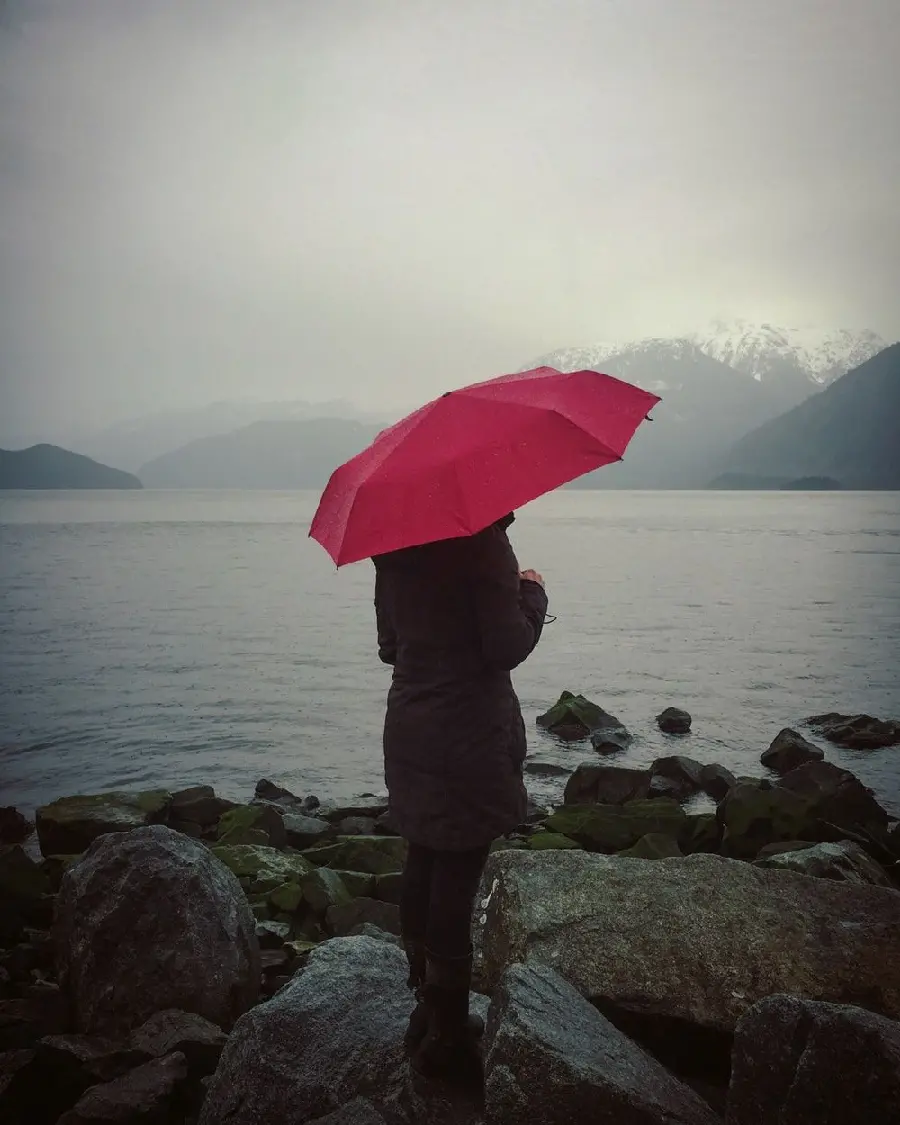 Red umbrella by the beach high quality photo