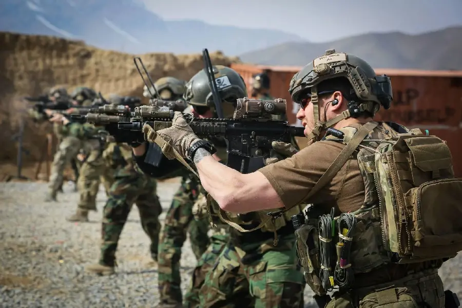 Military Special Forces Shooting with Weapons in Shooting Range