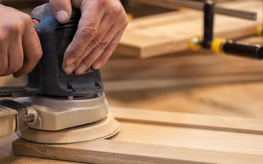 Picture of a carpenter working with electrical equipment