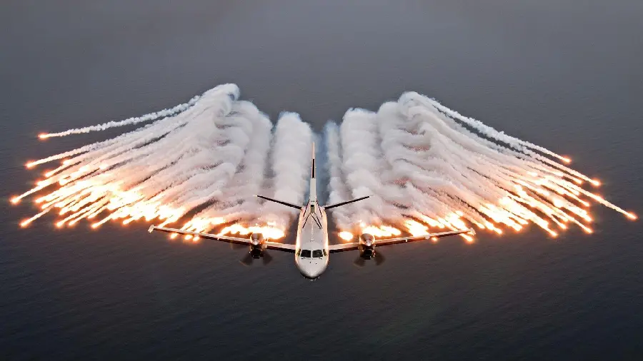 Image of a plane maneuvering against war missiles