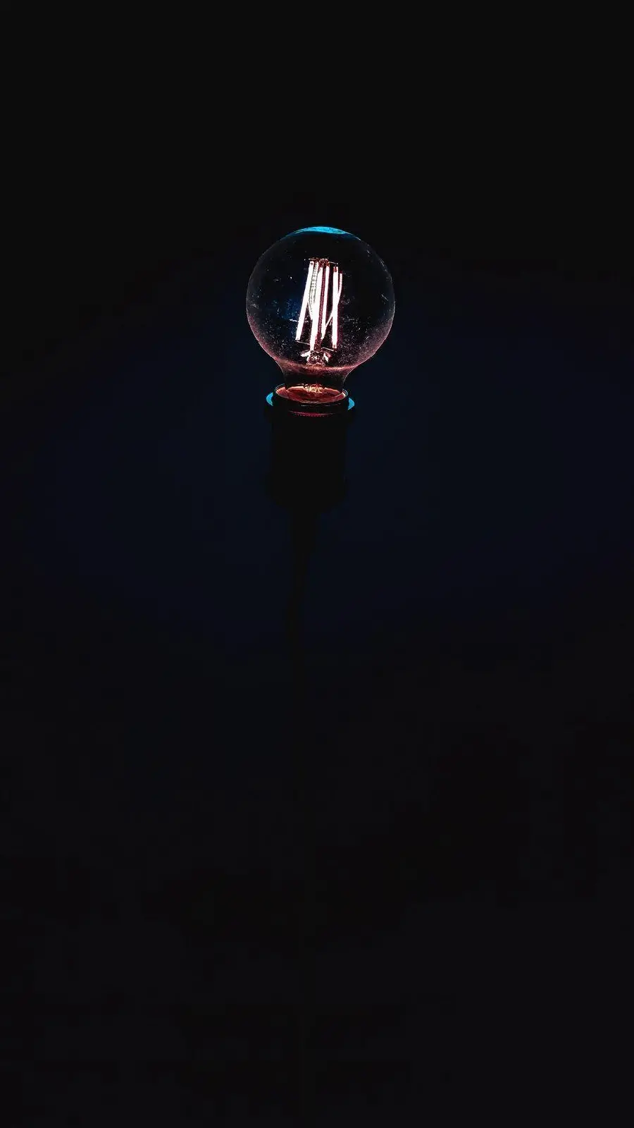 Light bulb wallpaper on black background for iPhone