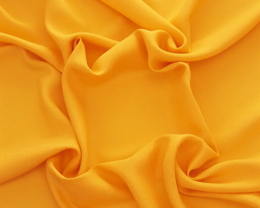 Photo of fabric texture with a cheerful and warm orange color