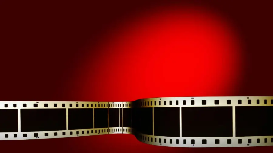 Red background with black film strip for editing