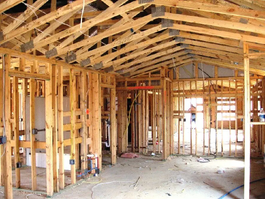 Photo of a wooden house under construction