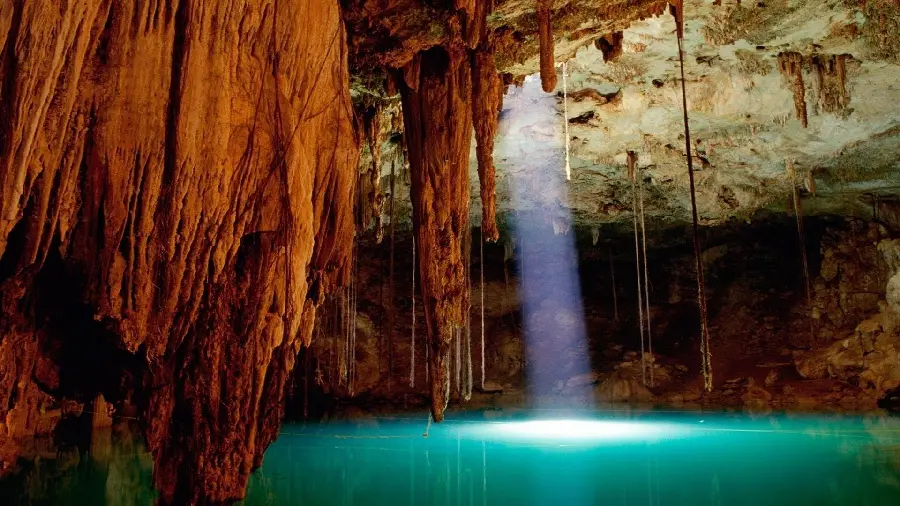 Download pictures of natural caves with a lamp and water