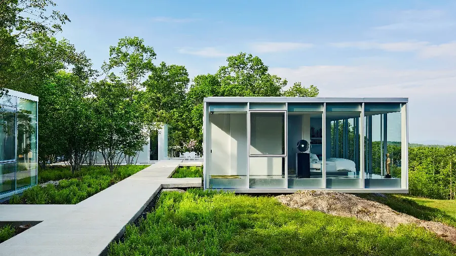 Photo of large villas with glass facades and windows