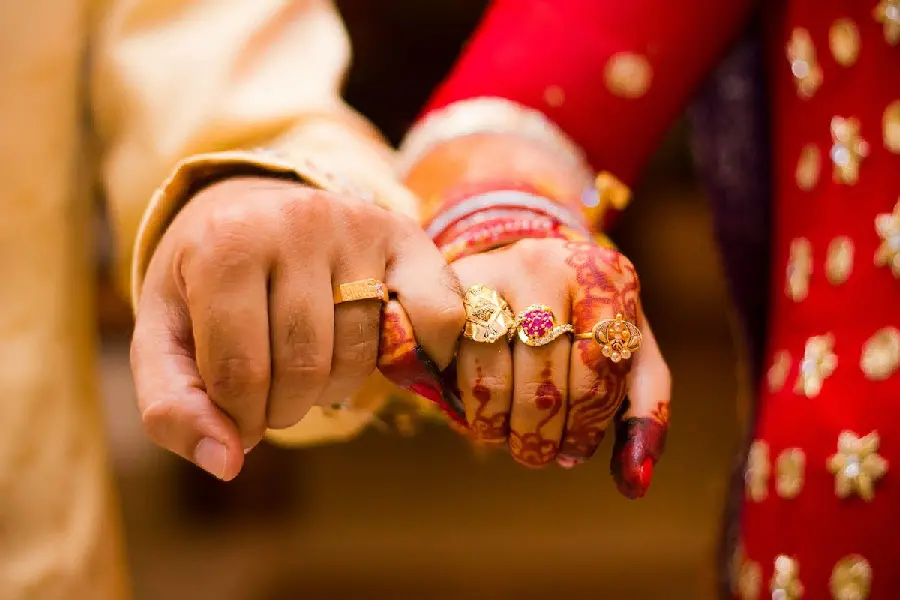 Sample photo of bride and groom hands and wedding photos