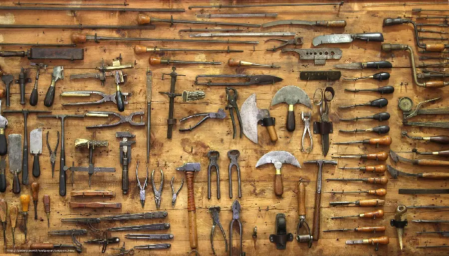 Photo of a neat and tidy bed of hand tools in an old workshop