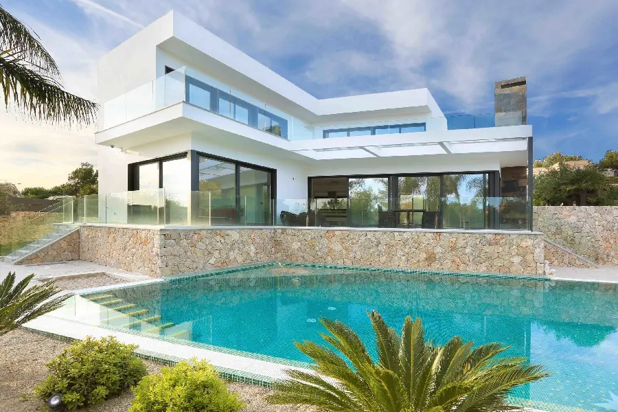 Image of modern villa by the pool with large glass windows