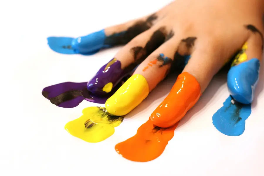 Photo of hands covered in paint
