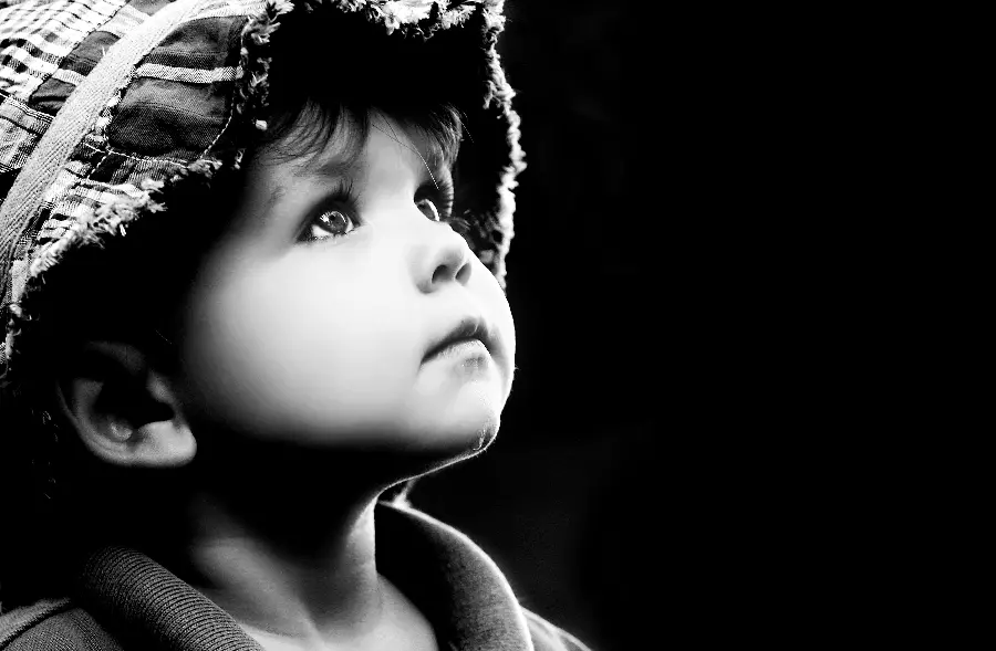 Photo of a lonely and black and white boy