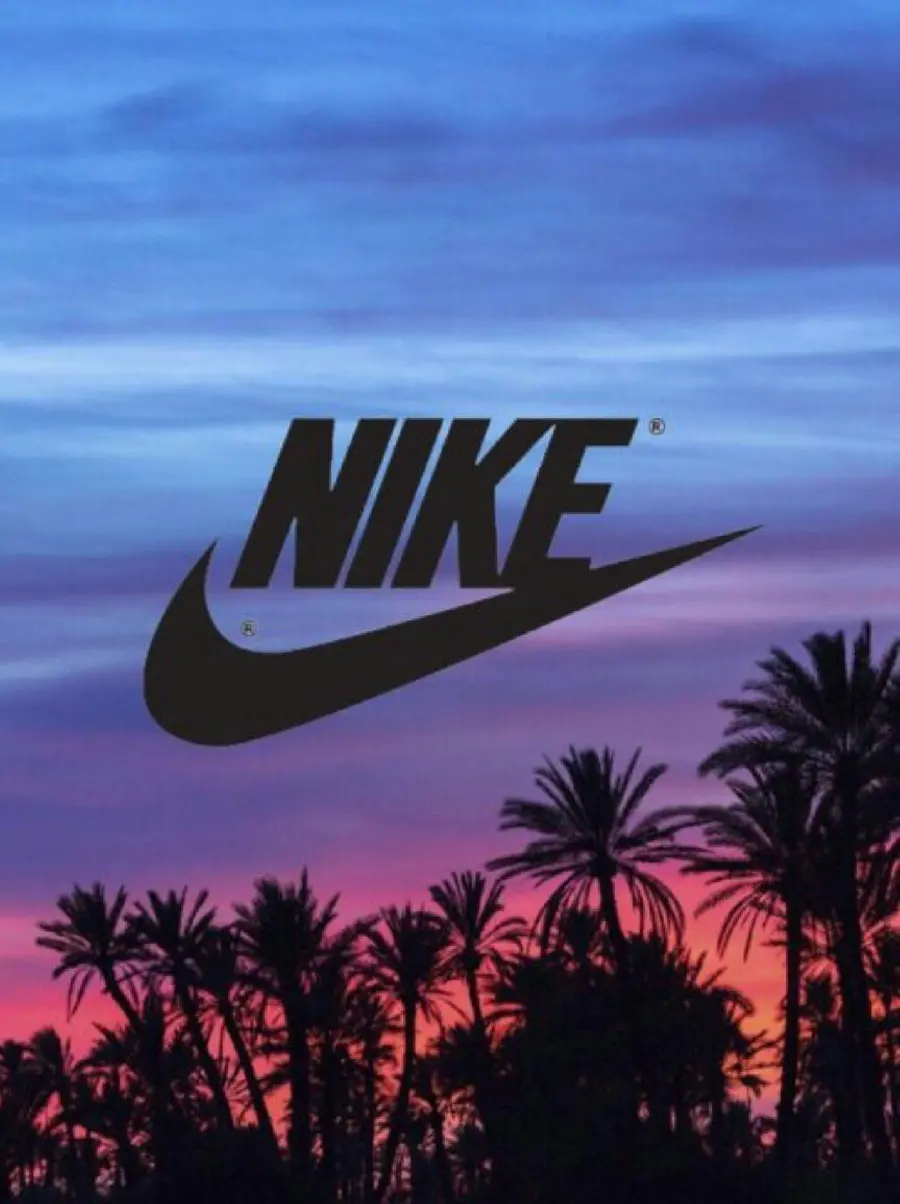 Black Nike Logo on Sunset Beach Background