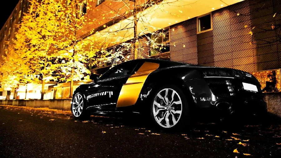 A very beautiful background of a black car on a dreamy background with bright colors
