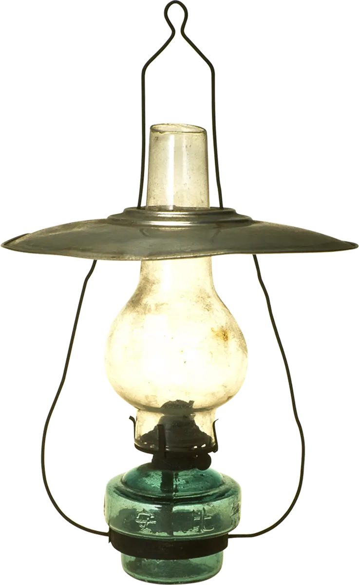 Photo of a lighted glass oil lamp without a background