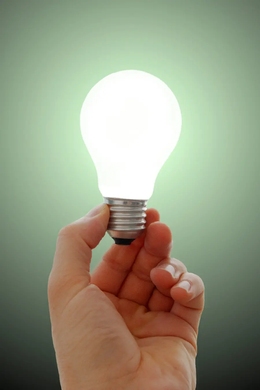 Photo of an LED light bulb in a human hand