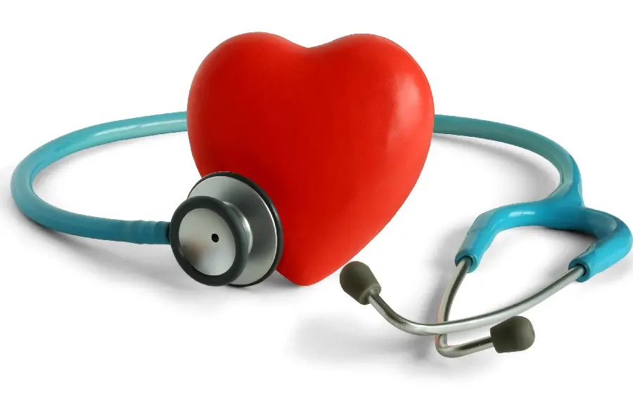 Photo of a stethoscope examining a red heart, heart health