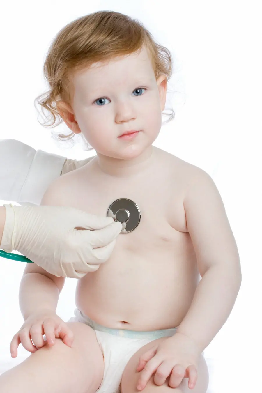 Photo of a doctor examining a baby and a child
