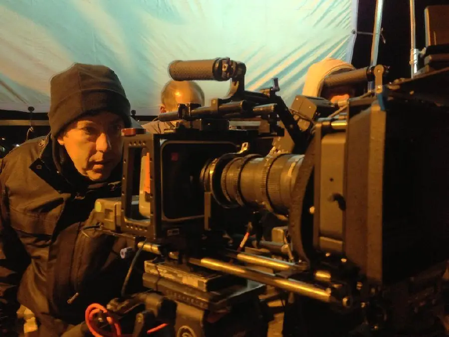 Photo of film director watching the filming scene