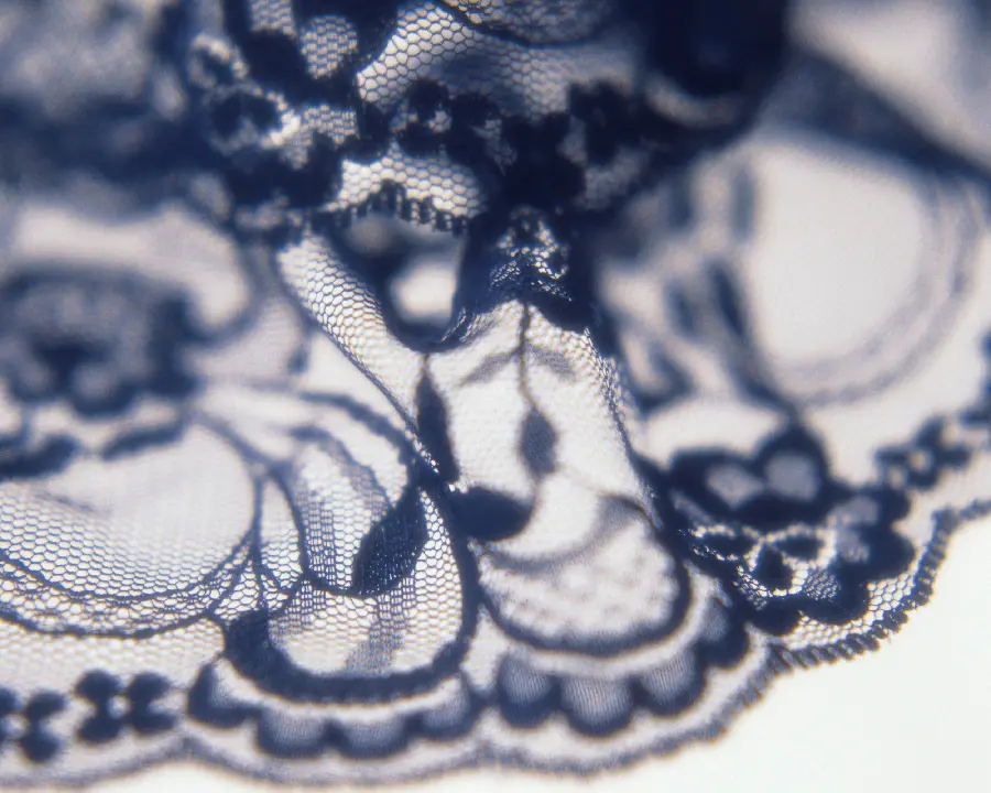 Background with the theme of beautiful black lace fabric texture and material