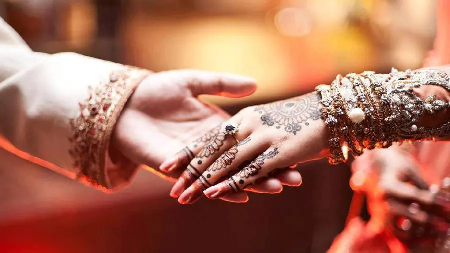Indian bride and groom's wedding hands