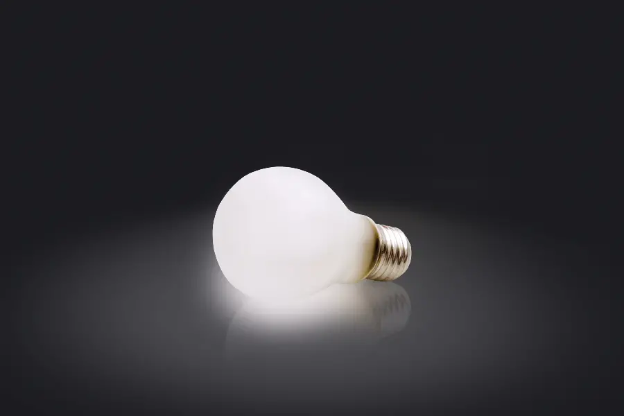 Photo of a bright lamp on a dark background