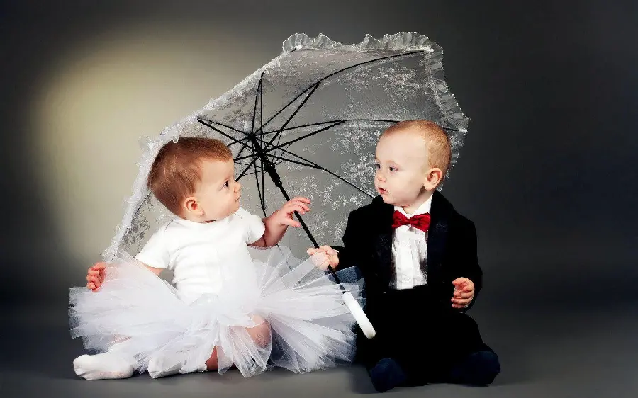 Photos taken in the studio of a girl and a boy as a bride and groom