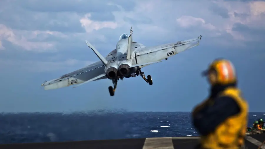 Image of a plane taking off a fighter jet