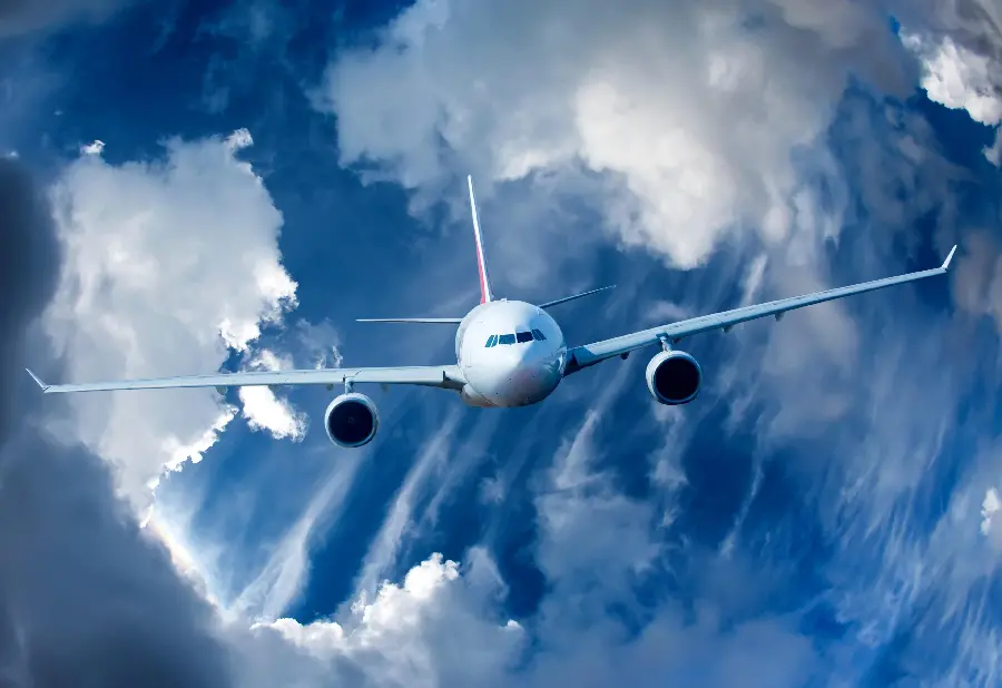 Download Airplane Wallpaper Flying next to the clouds