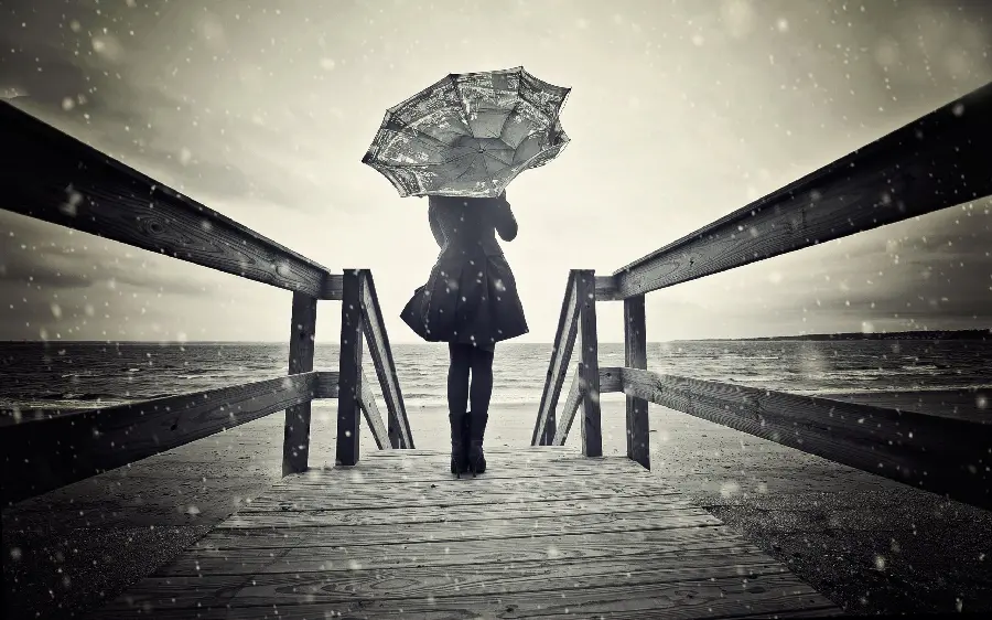 Black and white photo of a girl and an umbrella in her hands Nar Sahel