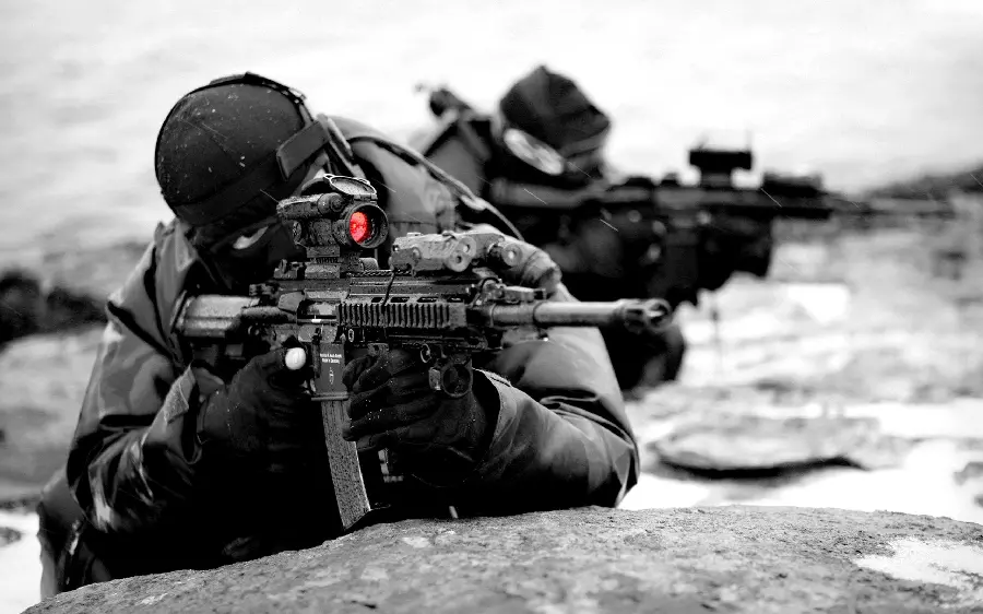 Special forces with a heavy weapon and black clothes