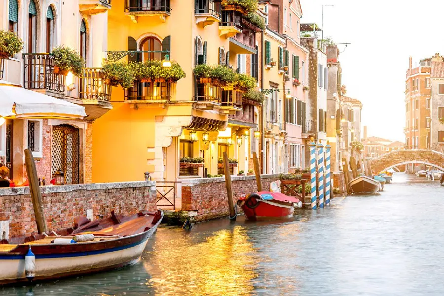 Picture of boats parked next to houses in Italy