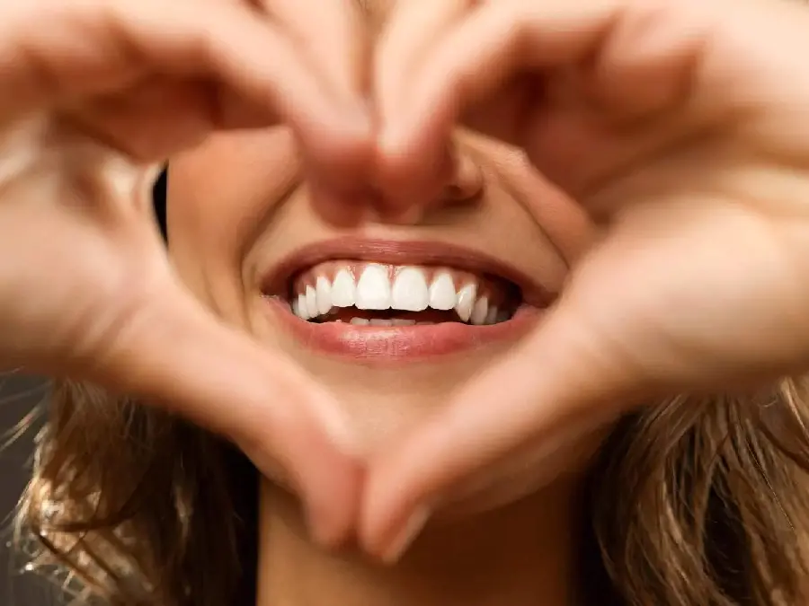 Photo of attractive white teeth of a woman for a dental poster Medicine