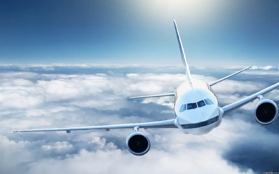 Image of a plane flying above the clouds in hd quality