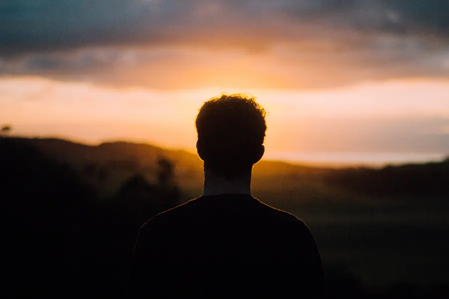 Sad boy's profile picture of a broken love at sunset