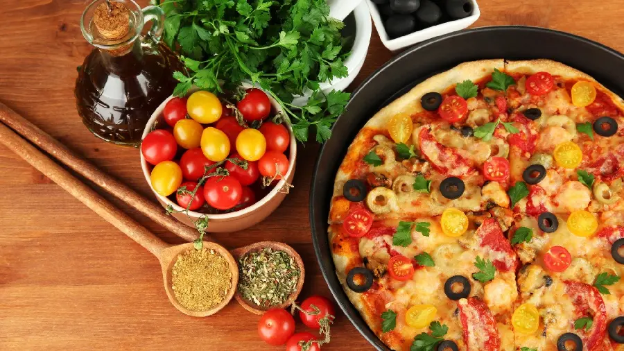 Image of Italian pizza with spices and tomatoes