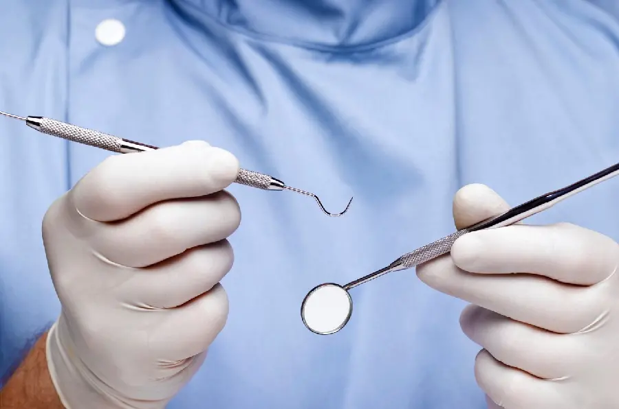 Photo of a dentist performing dental surgery